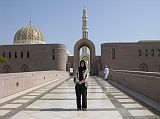 Muscat 04 Grand Mosque 03 Entrance With Female Dress Code Women visiting the mosque have to cover almost everything from their hair and neck to shoulders, arms and legs. Here is Charlotte in her official dress code to enter Muscats Grand Mosque.